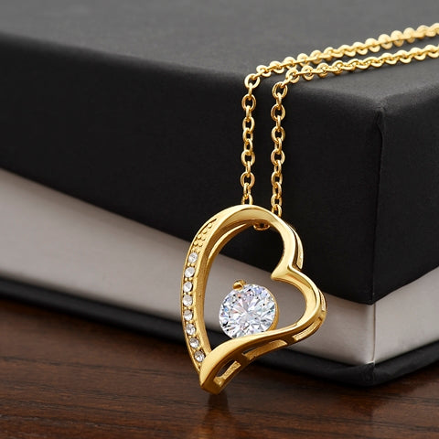 A close-up of the Forever Love Necklace with its delicate chain and charm.